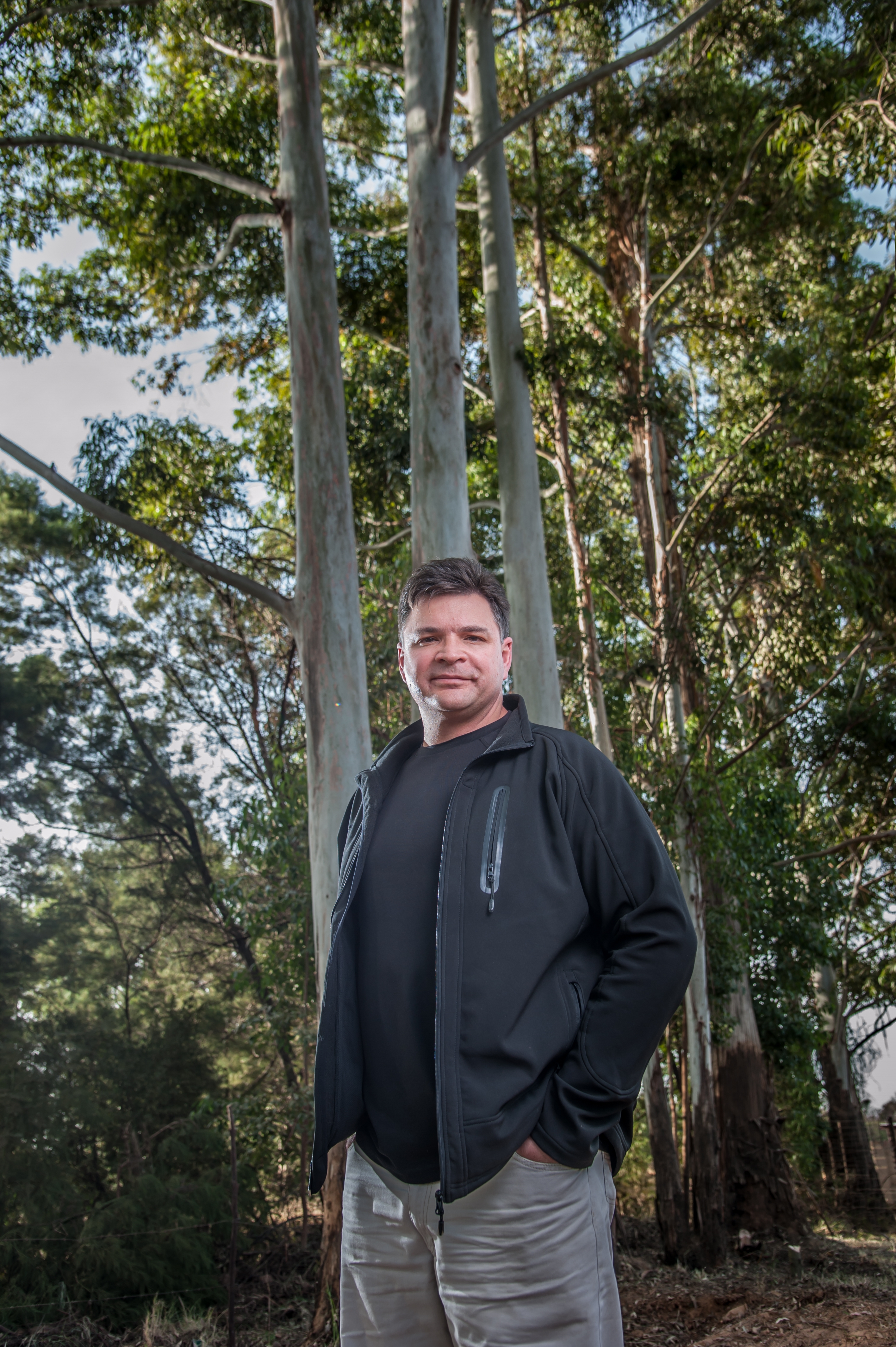 Professor Zander Myburg of the University of Pretoria, South Africa, in front of Eucalypt trees. Photo by Photowise.